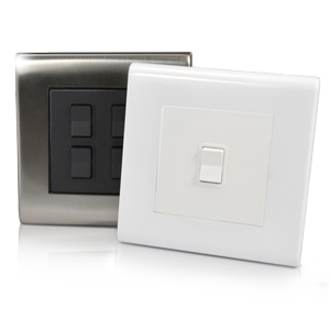 flex7 plug in switches, one in brushed steel with black module, one with white frame, and white module.